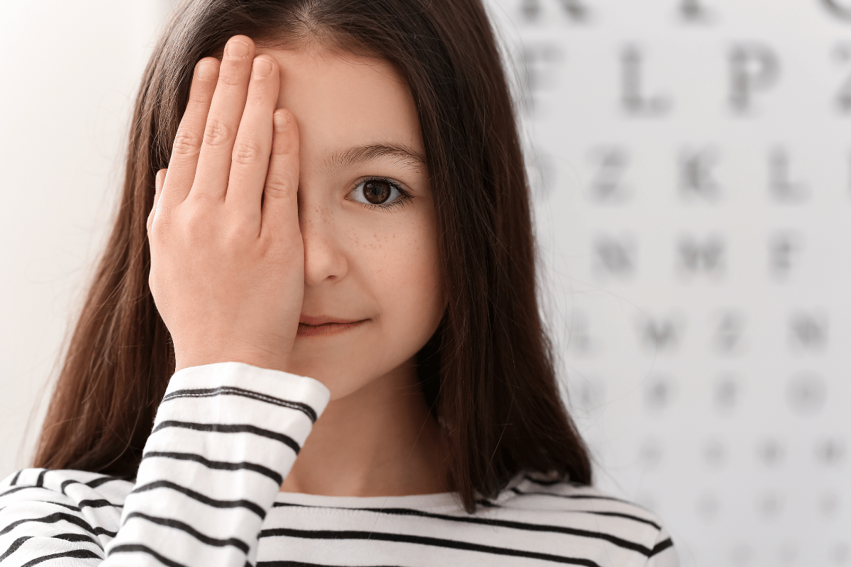 a little girl getting an eye exam